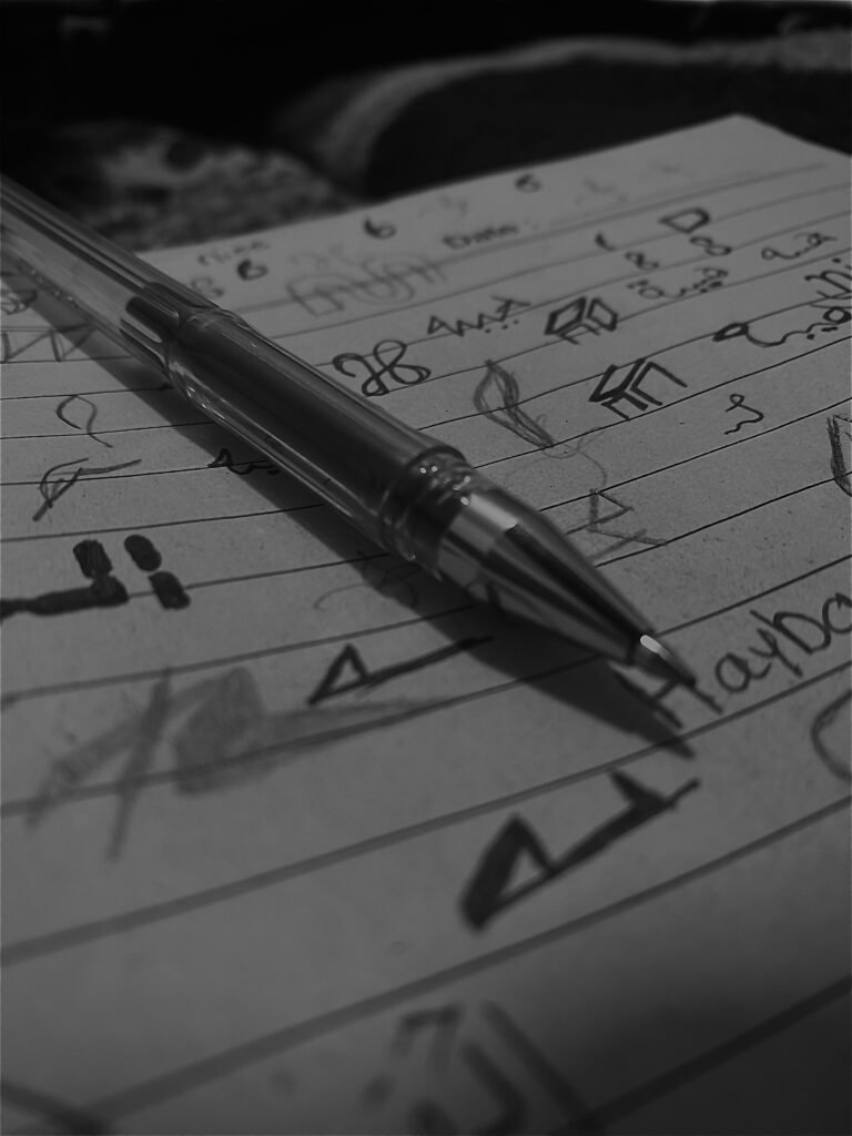 image of pen and paper with some drawings